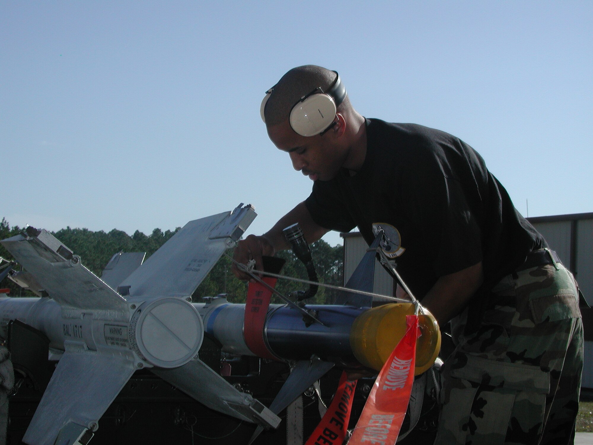 Airman 1st Class Carl Bradley inspects an AIM-9 missile during a Load Crew of the Quarter competition. 