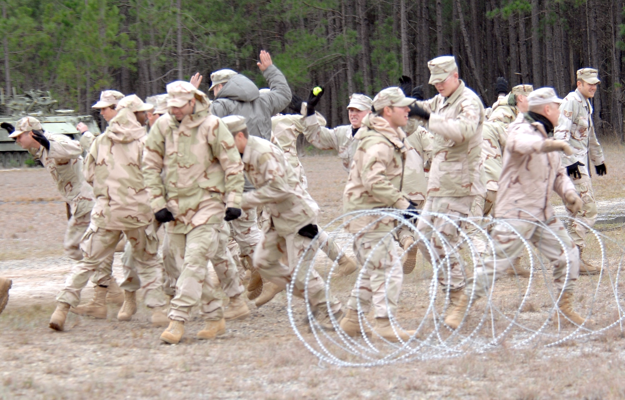 820th Security Forces Group Airmen react to being engaged by the Active Denial System during a perimeter security scenario Jan. 24 at Moody Air Force Base, Ga. Some of the intended benefits of ADS include helping troops secure perimeters, peacekeeping, humanitarian assistance and crowd disperal. (U.S. Air Force photo/Airman 1st Class Gina Chiaverotti)
