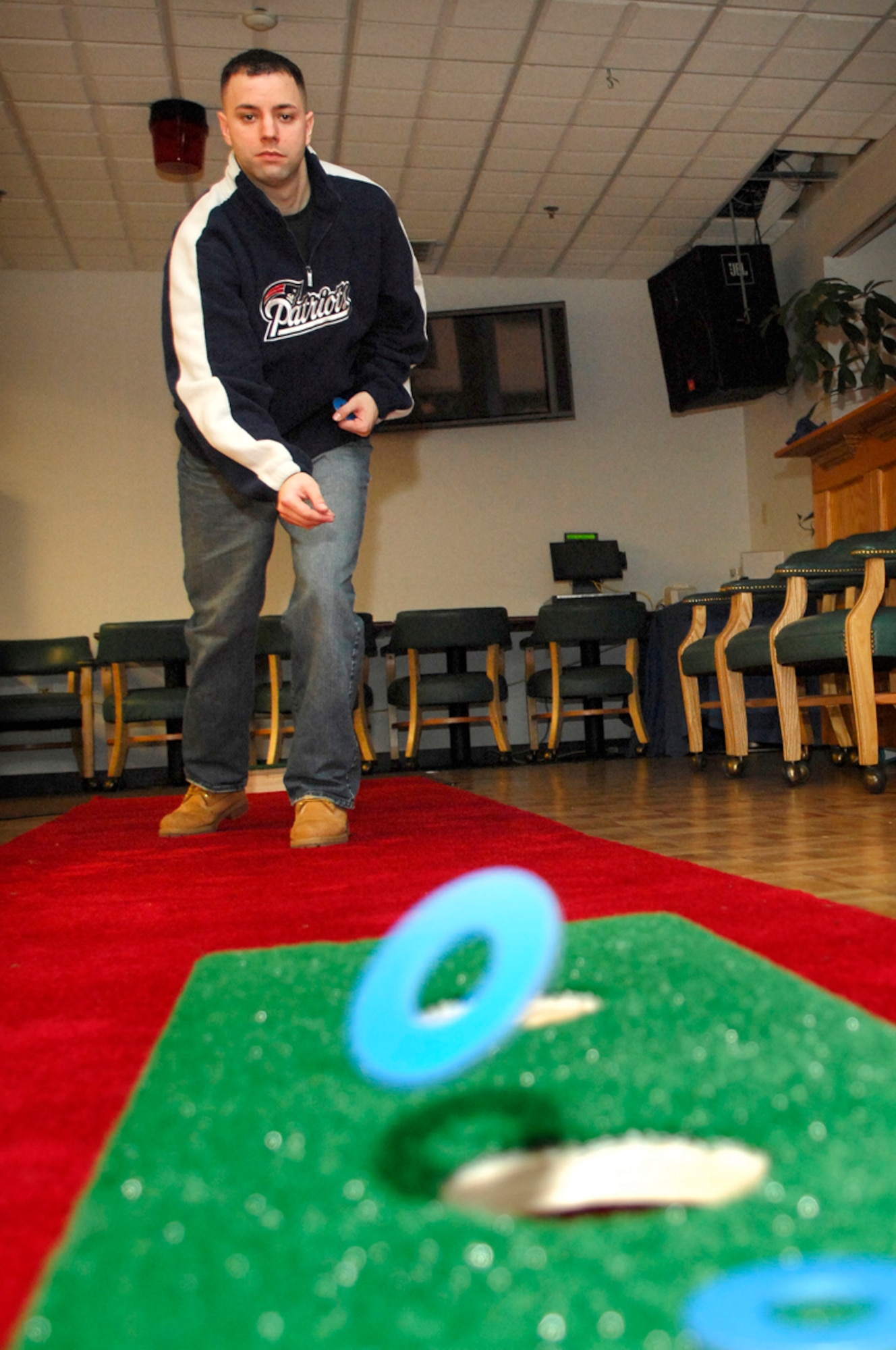 Staff Sgt. Phil Pelletier, Hanscom Patriot Honor Guard, hones his washer throwing skill during the recent Washers Tournament practice at the Minuteman Club. Washers is an indoor and outdoor game that is played and scored similarly to horseshoes. The first quarterly tournament will be held at 4:30 p.m. on Feb. 2, during Member’s Night at the Minuteman Club. Team registration is required, call (781) 377-9939 for more information. (US Air Force Photo by Mark Wyatt)