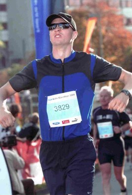 COLOGNE, GERMANY -- Lawrence Herstel savors crossing the Cologne Marathon finish line after nearly a year of training. (Courtesy photo)