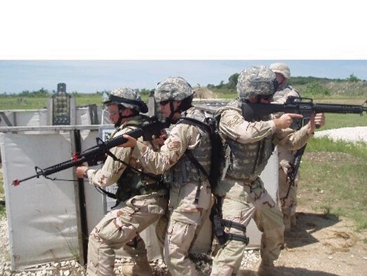 1st Lt. Ben Taber, 52nd Logistics Readiness Squadron, performs a room clearing drill at Fort Hood, Texas, as part of his pre-deployment training. (Courtesy photo)