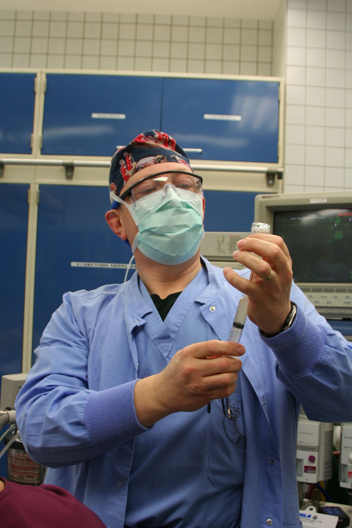 Lt. Col. Kevin Scharff, 52nd Medical Operations Squadron Anesthesia Services chief at Spangdahlem Air Base, Germany, dilutes a prophylactic antibiotic for a scheduled Cesarean section at the Bitburg Annex Hospital Jan. 9. National Nurse Anesthetist Week is Jan. 20-27, and honors Certified Registered Nurse Anesthetists and educates people on the importance of their work. Nurse anesthetists have been working with surgeons, dentists and podiatrists for 150 years to deliver safe anesthetic care. The Bitburg hospital has three nurse anesthetists on staff who provide care to hundreds of Sabers each year. (US Air Force photo by Senior Airman Eydie Sakura)