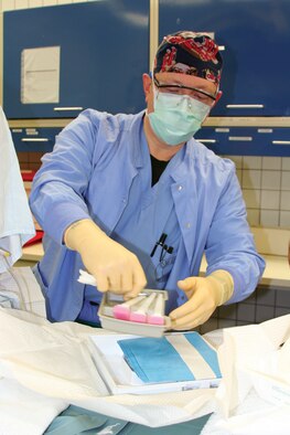 Lt. Col. Kevin Scharff, 52nd Medical Operations Squadron Anesthesia Services chief at Spangdahlem Air Base, Germany,  prepares his work area before administering a spinal anesthetic to his patient before a scheduled Cesarean section at the Bitburg Annex Hospital Jan. 9.  National Nurse Anesthetist Week is Jan. 20-27, and honors Certified Registered Nurse Anesthetists and educates people on the importance of their work. Nurse anesthetists have been working with surgeons, dentists and podiatrists for 150 years to deliver safe anesthetic care. The Bitburg hospital has three nurse anesthetists on staff who provide care to hundreds of Sabers each year. (US Air Force photo by Senior Airman Eydie Sakura)