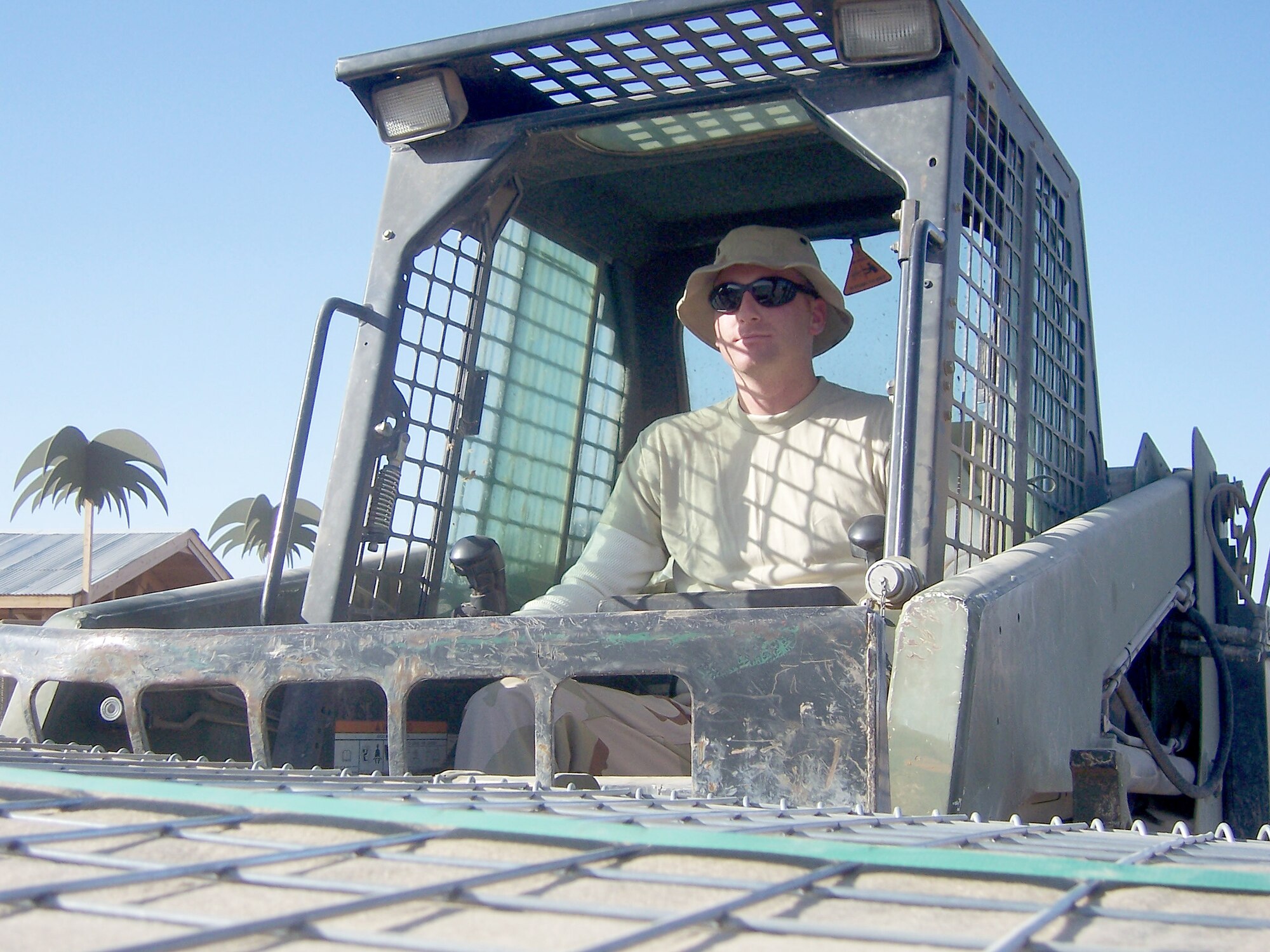 Staff Sgt. Jason Bailey, 603rd Air Control Squadron heating, ventilation and air conditioning journeyman, moves supplies at Kandahar Air Base, Afghanistan. (Courtesy photo)