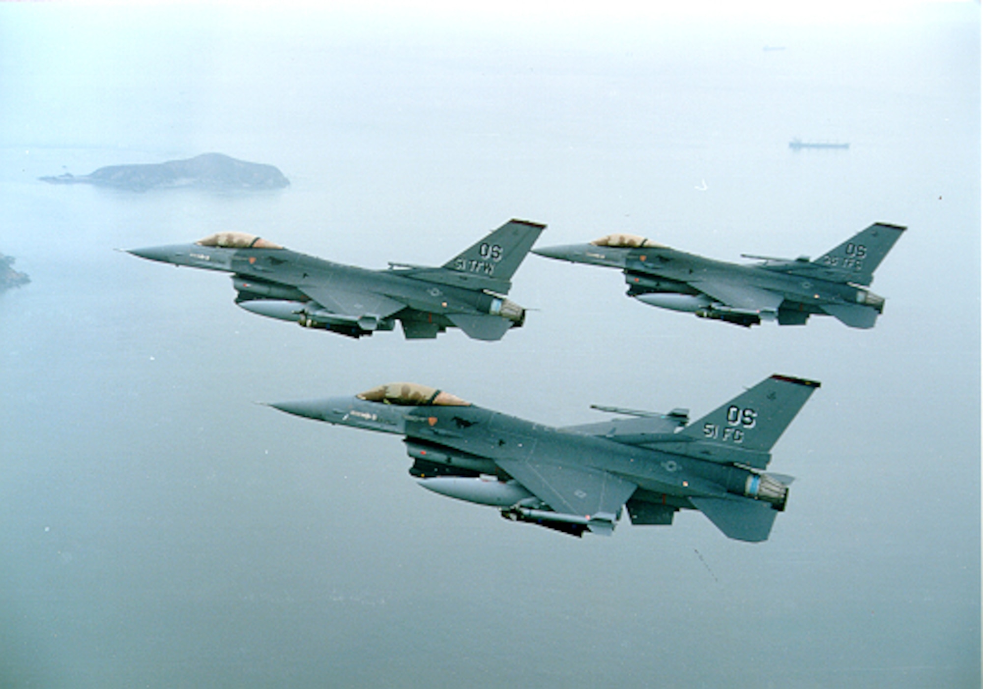 Three F-16s in flight.