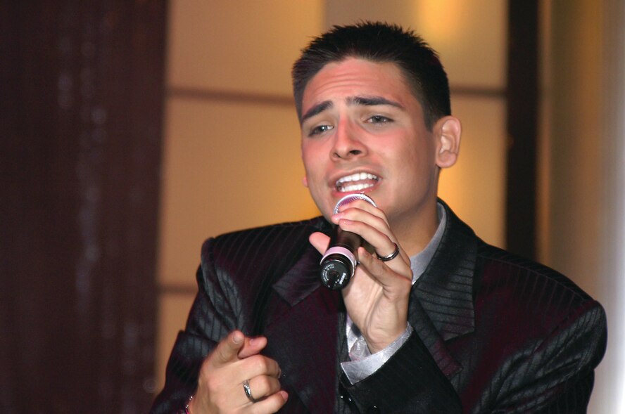 OSAN AIR BASE, Republic of Korea --  Senior Airman Rick Rosales, 51st Dental Squadron, performs his winning number "Mercy Said No" to capture the title as First Place Male Vocalist during the Air Force Worldwide Talent contest Nov. 5-13. (U.S. Air Force photo by Maj. Chris Burch)