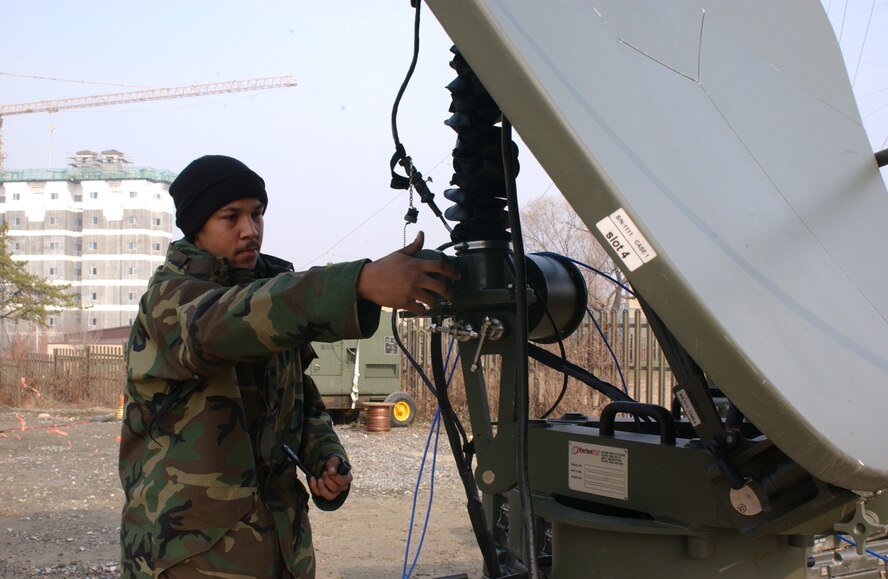 OSAN AIR BASE, Republic of Korea --  Senior Airman Jesse Coleman, 607th Combat Communications Squadron, prepares one of the tactical satellites to be torn down Wednesday after it has been able to communicate with other satellites around the peninsula. (U.S. Air Force photo by Senior Airman Eunique Stevens)