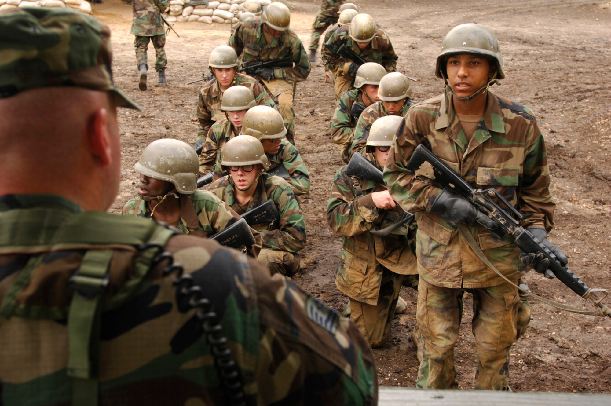 Field Training Instructor Tech. Sgt. Christopher Irvin of the 737th Training Squadron corrects Airmen on how to report a munitions attack. 