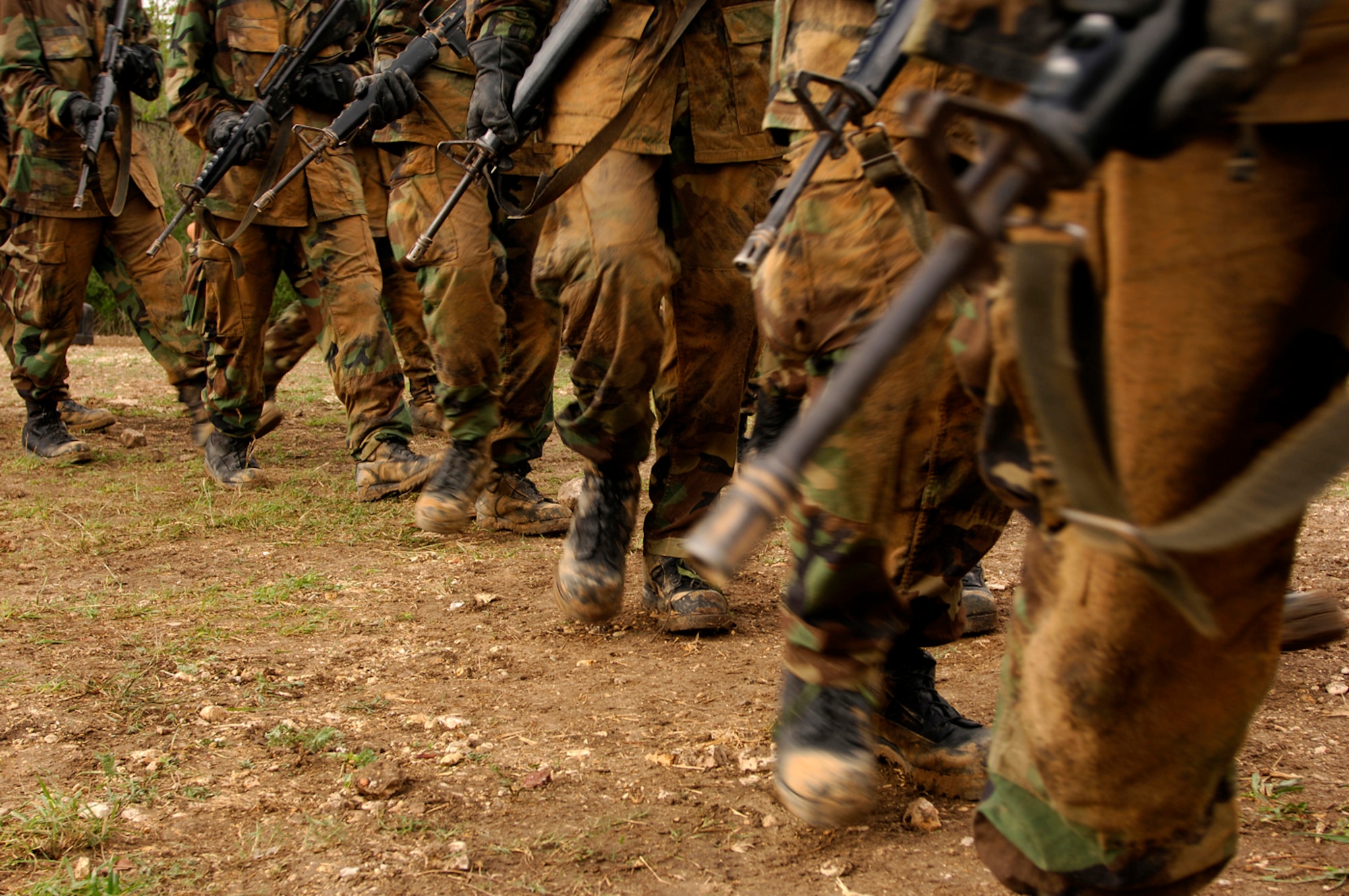 Basic trainees march to Base X during week four of training with their imitation M-16 in hand. The new recruits carry their weapons almost everywhere they go for nearly the first month of training.