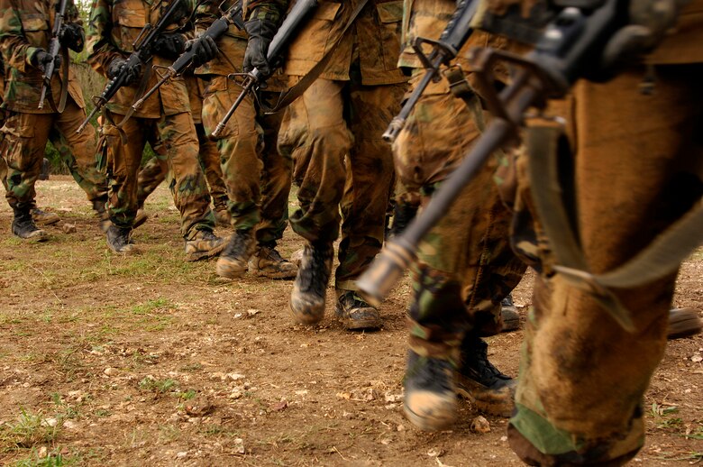 Basic trainees march to Base X during week four of training with their imitation M-16 in hand. The new recruits carry their weapons almost everywhere they go for nearly the first month of training.