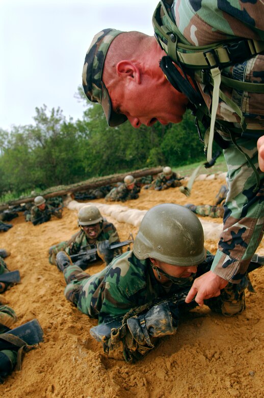 Staff Sgt. James Coppola aggressively instructs trainees to help give them the pressure of being in a battle. 