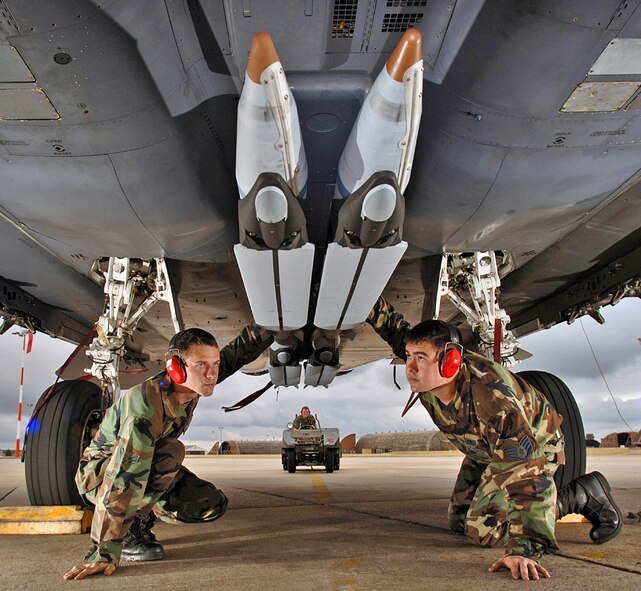 U.S. Air Force Airman 1st Class Matt Aggers, left, and Staff Sgt. Randy Broome conduct a final check of the stowed twin wings on four ground-training GBU-39 small diameter bombs after being loaded on an F-15E Strike Eagle aircraft at Royal Air Force Station Lakenheath, England. The Air Force Operational Test and Evaluation Center evaluated the SDB weapon system that is intended to provide the United States Air Force with a tactical standoff air-to-surface strike capability for both current and future fighter and bomber aircraft.  Both Airmen are aircraft weapons specialists from the 48th Aircraft Maintenance Squadron. (DOD photo by Master Sgt. Lance Cheung, U.S. Air Force)