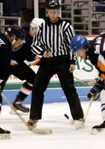 Christopher Pace, Air Force forward, faces off at the start of the game against his Coast Guard opponent. (U.S. Air Force photo by Staff Sgt. Ricky Bloom)