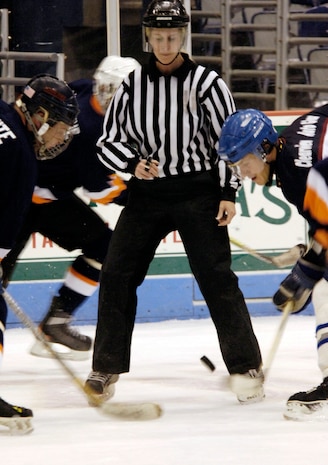Christopher Pace, Air Force forward, faces off at the start of the game against his Coast Guard opponent. (U.S. Air Force photo by Staff Sgt. Ricky Bloom)