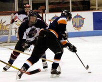 Gerrick Hoffman, Air Force defender, moves to block a Coast Guard attacker during the game. (U.S. Air Force photo by Staff Sgt. Ricky Bloom)