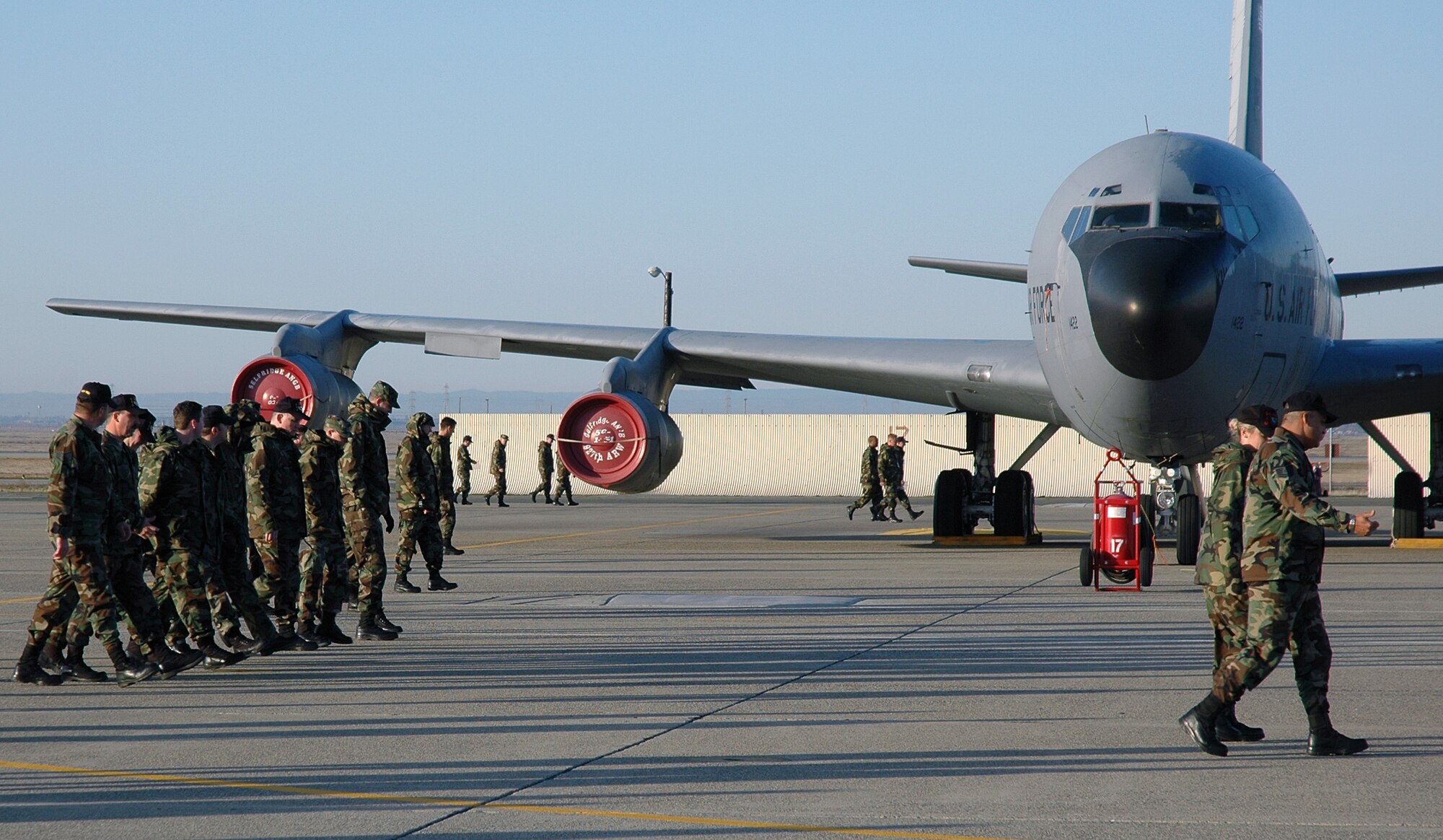 Reservists from the 940th Air Refueling Wing participate in a foreign object debris walk during a unit training assembly weekend at Beale Air Force Base, Calif. on Jan. 7, 2007. FOD walks ensure the flight line is free from any small objects that may cause damage to jet aircraft engines during normal flight operations. (U.S. Air Force Photo/ Staff Sgt. Luke Johnson)
