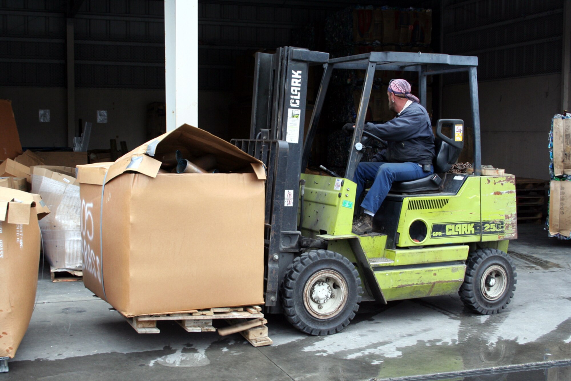 A automotive worker at the recycling plant moves pallets of recycled items to storage. Hurlburt Field has a world-class recycling program. Hurlburt's program educates, recycles and then reinvests in the community. 
More than 900,000 of metal and 1.7 million pounds of cardboard were recycled in 2006, returning $350,000 to Hurlburt's quality-of-life programs.  (U.S. Air Force Photograph by Dylan Laurie)