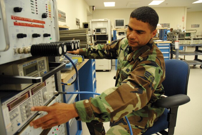 Senior Airman Louis Colon, 437th Maintenance Squadron precision measurement equipment laboratory journeyman, calibrates a radio frequency watt meter at the PMEL building Jan. 19. (U.S. Air Force photo/Senior Airman Sam Hymas) 