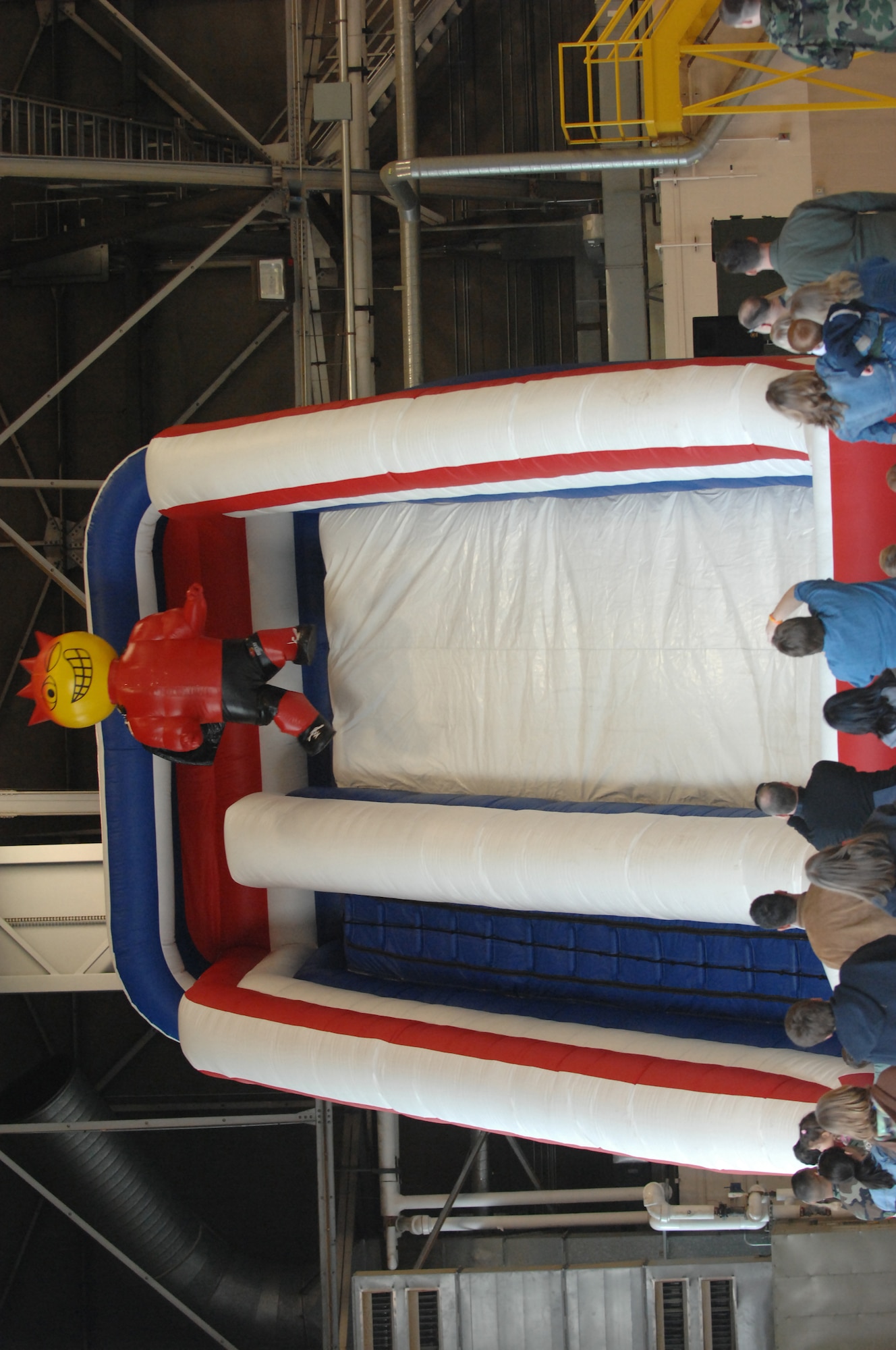 MCCHORD AIR FORCE BASE, Wash.-- After waiting in line, Sizzlin' Sid, 62nd Services Squadron mascot, finally gets to coast down the slide. (U.S. Air Force Photo/Abner Guzman)
