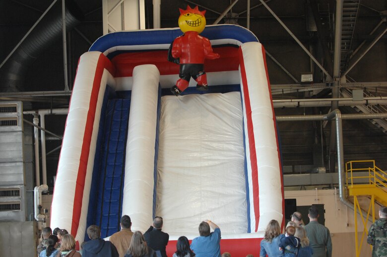 MCCHORD AIR FORCE BASE, Wash.-- After waiting in line, Sizzlin' Sid, 62nd Services Squadron mascot, finally gets to coast down the slide. (U.S. Air Force Photo/Abner Guzman)
