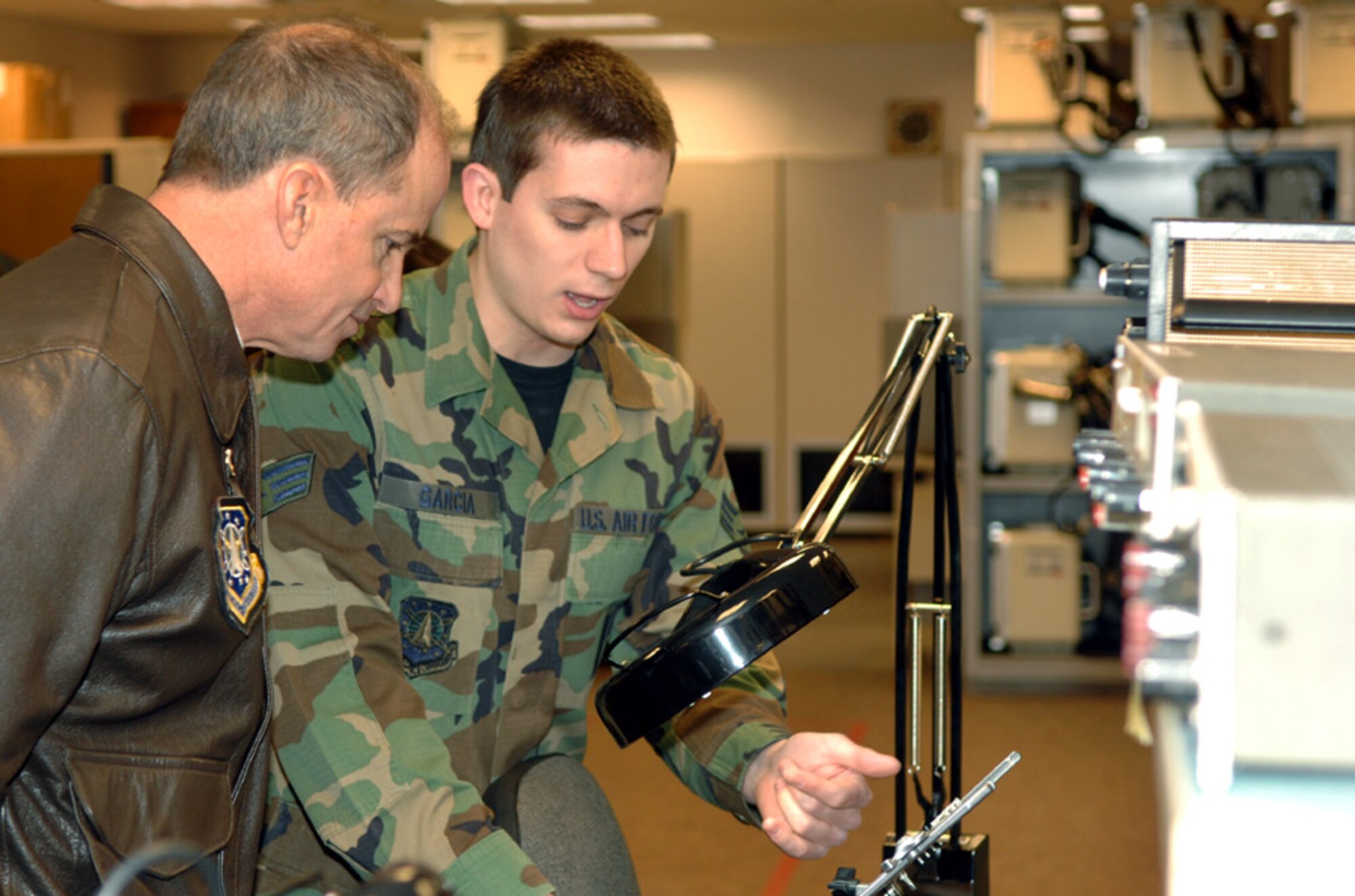 MINOT AIR FORCE BASE, N.D. – Gen. Kevin P. Chilton, Air Force Space Command commander, examines the work of Senior Airman Christopher Garcia, 91st Missile Operations Squadron, Jan. 23. General Chilton visited Minot’s 91st Space Wing as part of a base orientation to familiarize him with the wings now under his command. (U.S. Air Force photo by Airman 1st Class Christopher Boitz)