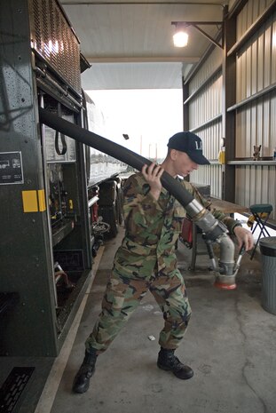 Airman 1st Class Daniel Queen, 437th Logistics Readiness Squadron fuels distribution operator, readies the new R-11 hybrid refueling truck Monday. (U.S. Air Force photo/Senior Airman Sam Hymas)