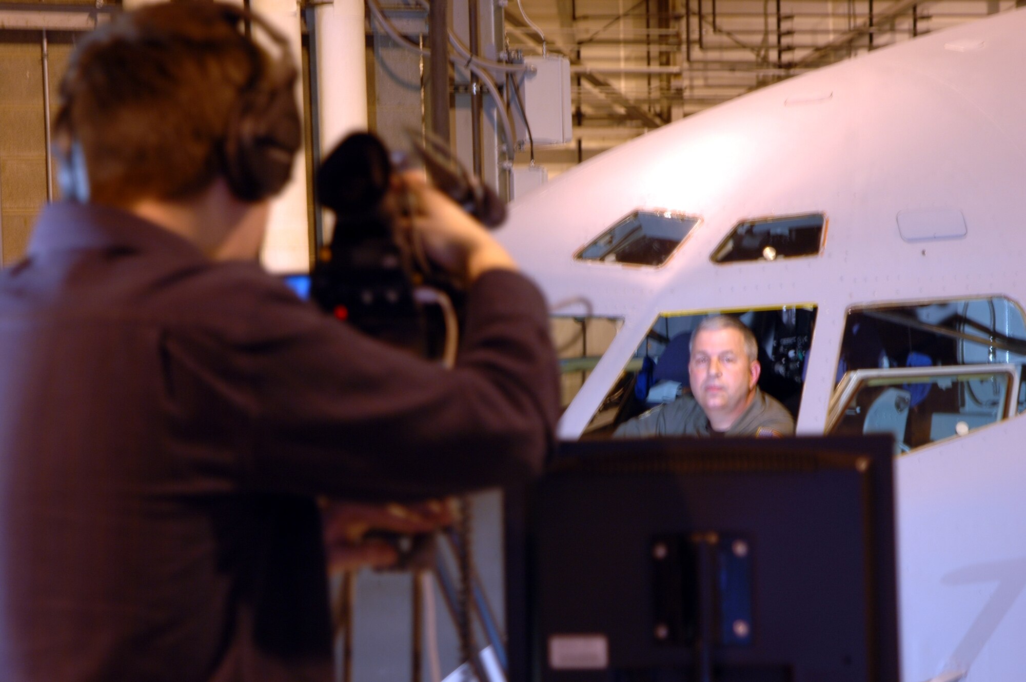 GRISSOM AIR RESERVE BASE, Ind., -- Brig. Gen. Dean Despinoy, 434th Air Refueling Wing commander,  records opening comments for Grissom's mission video during a taping session Jan. 25 in Dock 6. The video will be used to educate visitors and groups about Grissom's mission, history and the units that are stationed here. (U.S. Air Force photo/Tech. Sgt. Doug Hays)