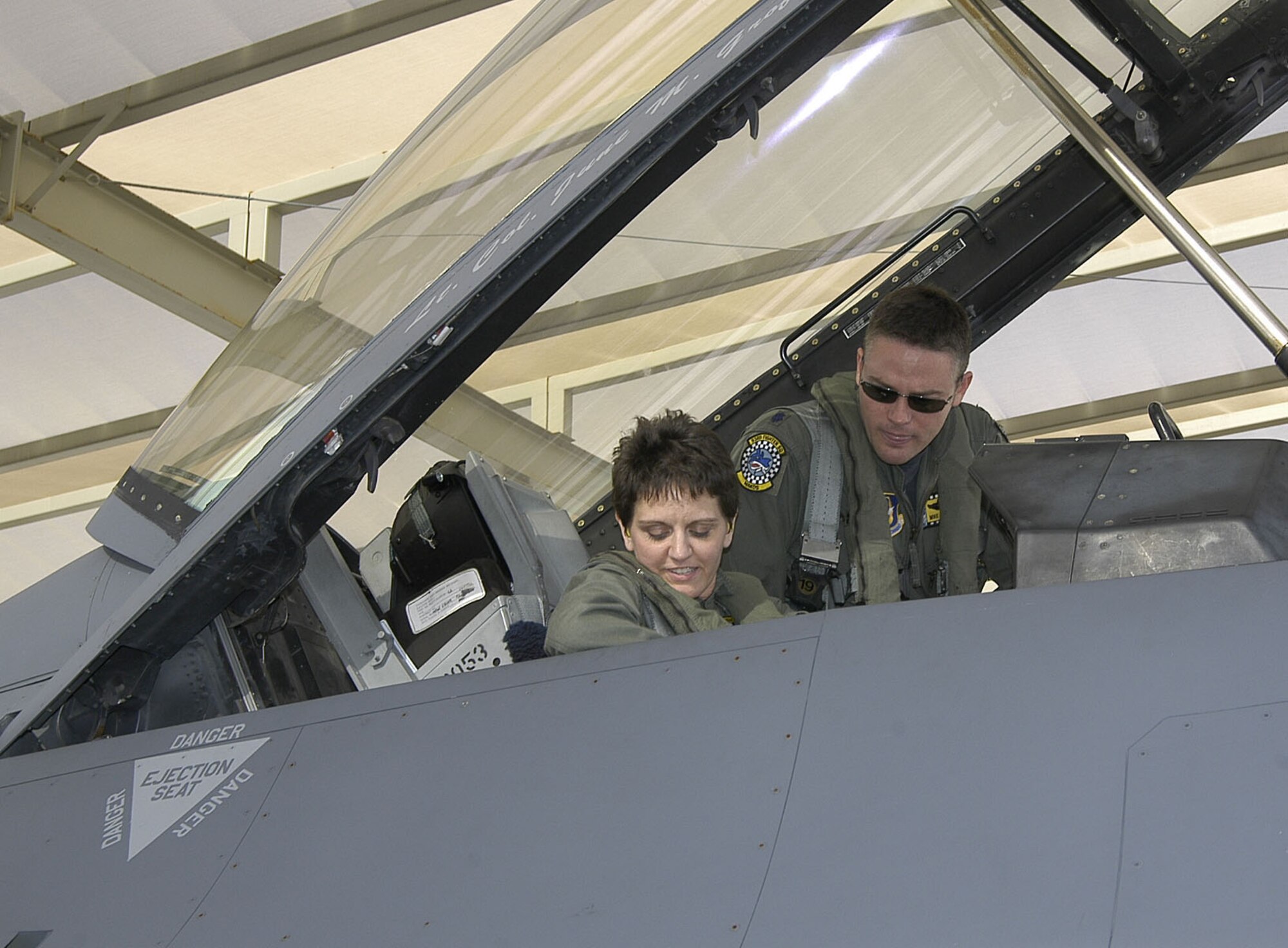 Senior Airman Dawn Larrieu, FY06 Get 1 Now award winner, receives last minute instuctions from Maj. Mike "Frosty" Hohman, 93rd Fighter Squadron, Homestead ARB, Fla., in preparation for her F-16 incentive ride. (U.S. Air Force photo/Master Sgt. Gary Johnson)                               