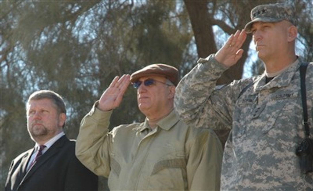 From right, U.S. Army Lt. Gen. Ray Odierno, commander of Multinational Corps - Iraq, Iraqi Minister of Defense Abdul Qadir Mohammed Jasim and Polish Minister of Defense Radoslaw Sikorski look on during a ceremony marking the change of command over Multinational Division Central - South at Camp Echo, Iraq, Jan. 24, 2007. 