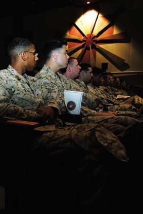 Service members, family and friends of the 7th Marine Regiment gather in the base theater to honor their fallen brothers at Marine Corps Air Ground Combat Center Twentynine Palms April 19.