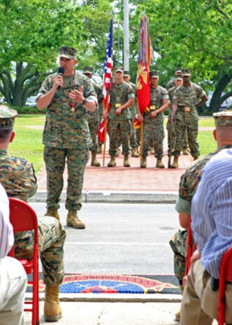 Col. Ron Johnson delivers his farewell remarks to assembled guests after relinquishing command of the 24th Marine Expeditionary Unit in a ceremony aboard Camp Lejeune April 26.