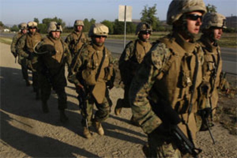 Marines of 1st Battalion, 1st Marine Regiment, 1st Marine Division persevered through a exhausting eight mile Infantry Skills Endurance Test here on May 27.