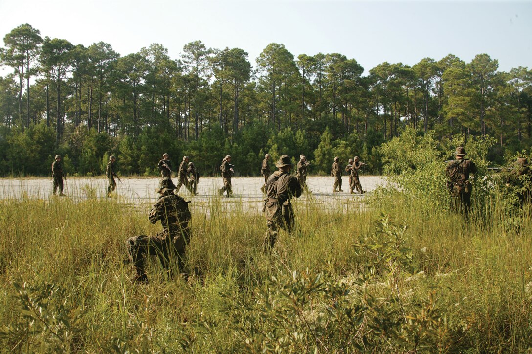 Mike Company's Platoon 3080 ambushes a squad on patrol during Event Five's Endurance Course at the Crucible on Page Field Sept. 28. The ambush gave the recruits an added opportunity to practice their combat skills.