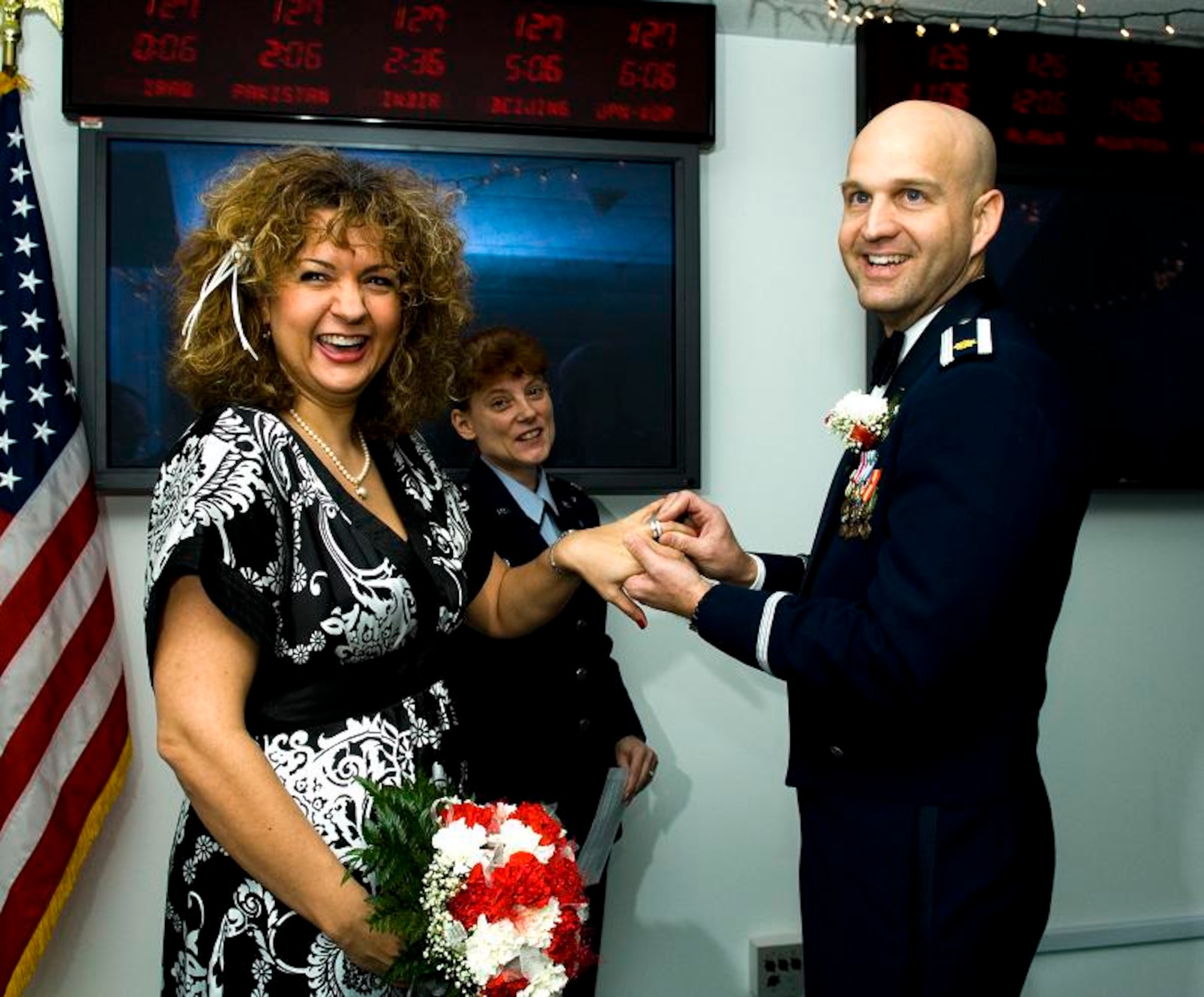 Maj. Greg Soukup, 611th Air Intelligence Squadron, received a short notice deployment to Iraq just 32 days before his long-time planned wedding to Kristen Owens. They were married by the 611th AIS commander, Lt. Col. Christine Morris, in the squadron Jan. 26.  (U.S. Air Force photo/Senior Airman Garrett Hothan)