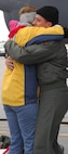MINOT AIR FORCE BASE, N.D. -- Maj. James Jagodzinski, 5th Operations Support Squadron, and his wife Wendy embrace on the flightline here Jan. 28. Major Jagodzinski along with 19 other Minot Airmen were met by friends and family upon arriving home from a five-month deployment to Andersen Air Force Base, Guam. (U.S. Air Force photos by Airman 1st Class Joe Rivera)