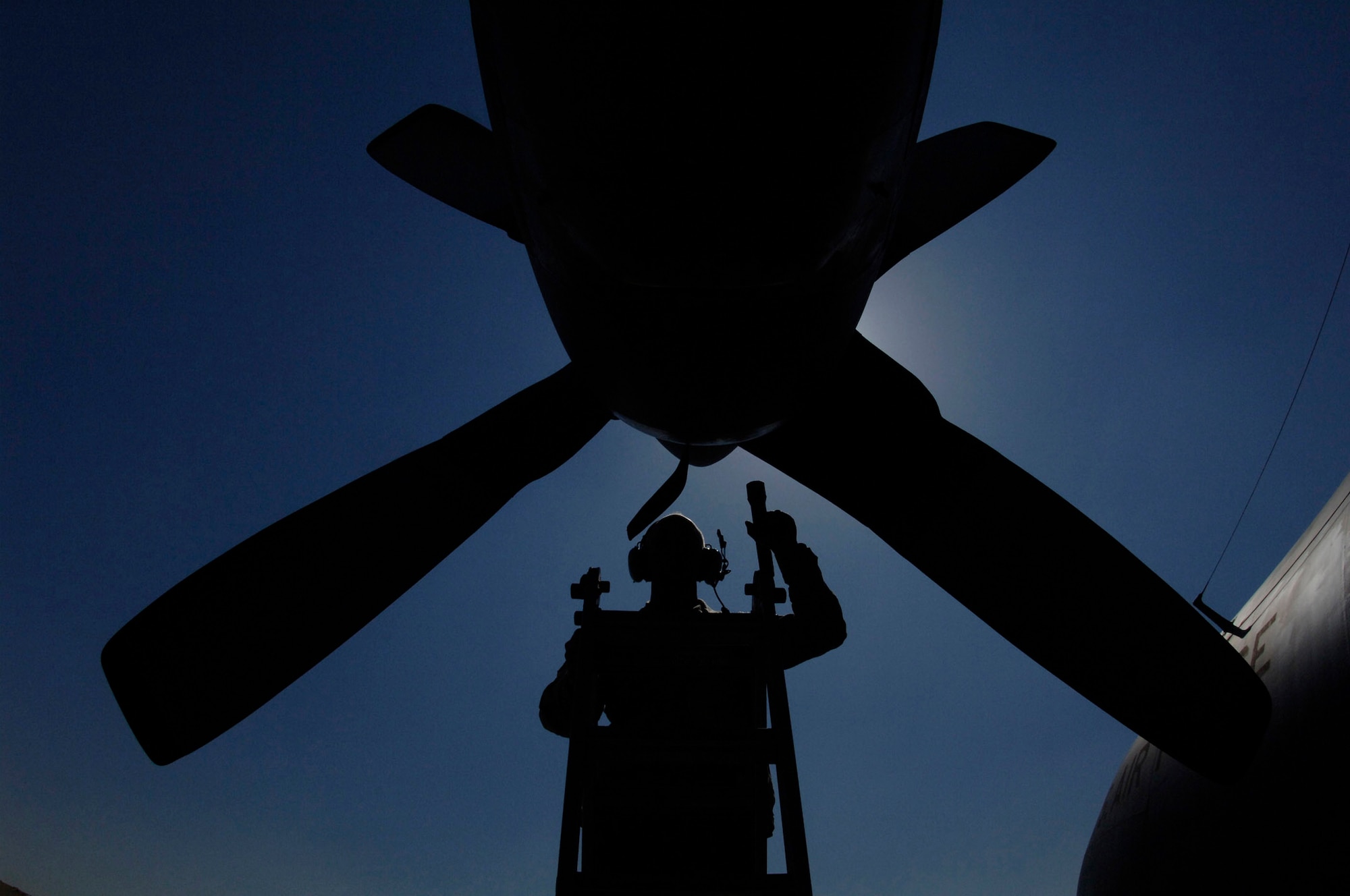 Tech. Sgt. John Ryan conducts a post-flight inspection of the turbine of a C-130 Hercules Jan. 25 in Southwest Asia. Sergeant Ryan is a 746th Aircraft Maintenance Unit crew chief. (U.S. Air Force photo/Staff Sgt. David Miller)