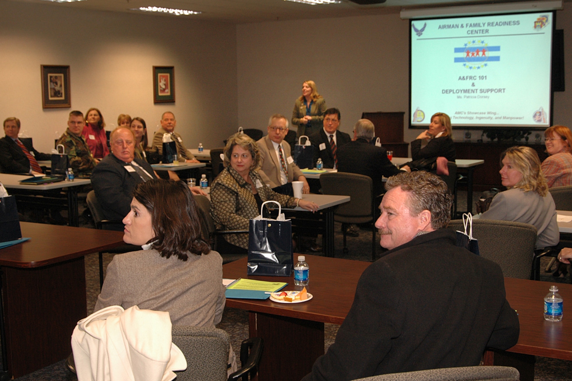 Superintendents listen attentively as they are briefed by members of Scott's Airman and Family Readiness Center.