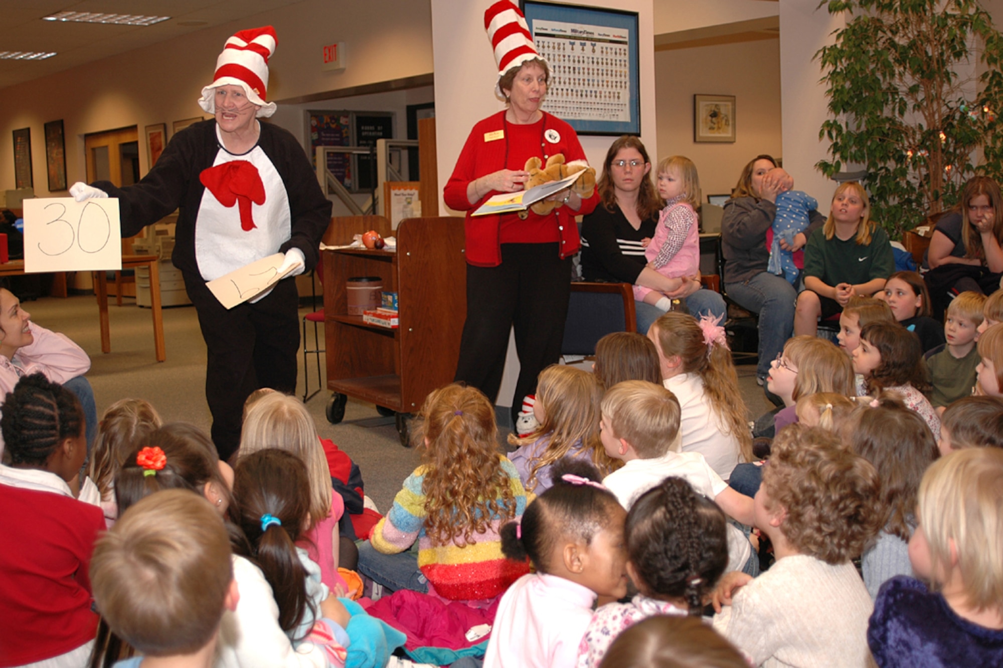 Members of the Base Library entertain patrons during "Dr. Suess Night."