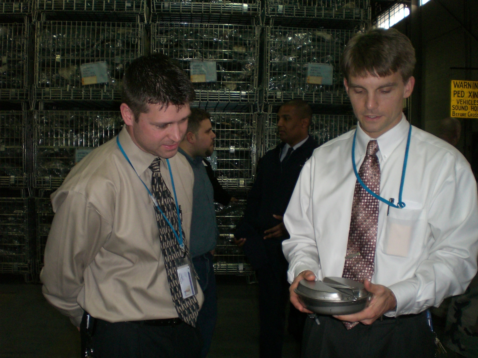 Educators examine various pieces of Air Force mobility equipment.  Educators visited McGuire Nov. 29 to learn about the Air Force and its mission. U.S. Air Force photo by Senior Airman Dilia DeGrego