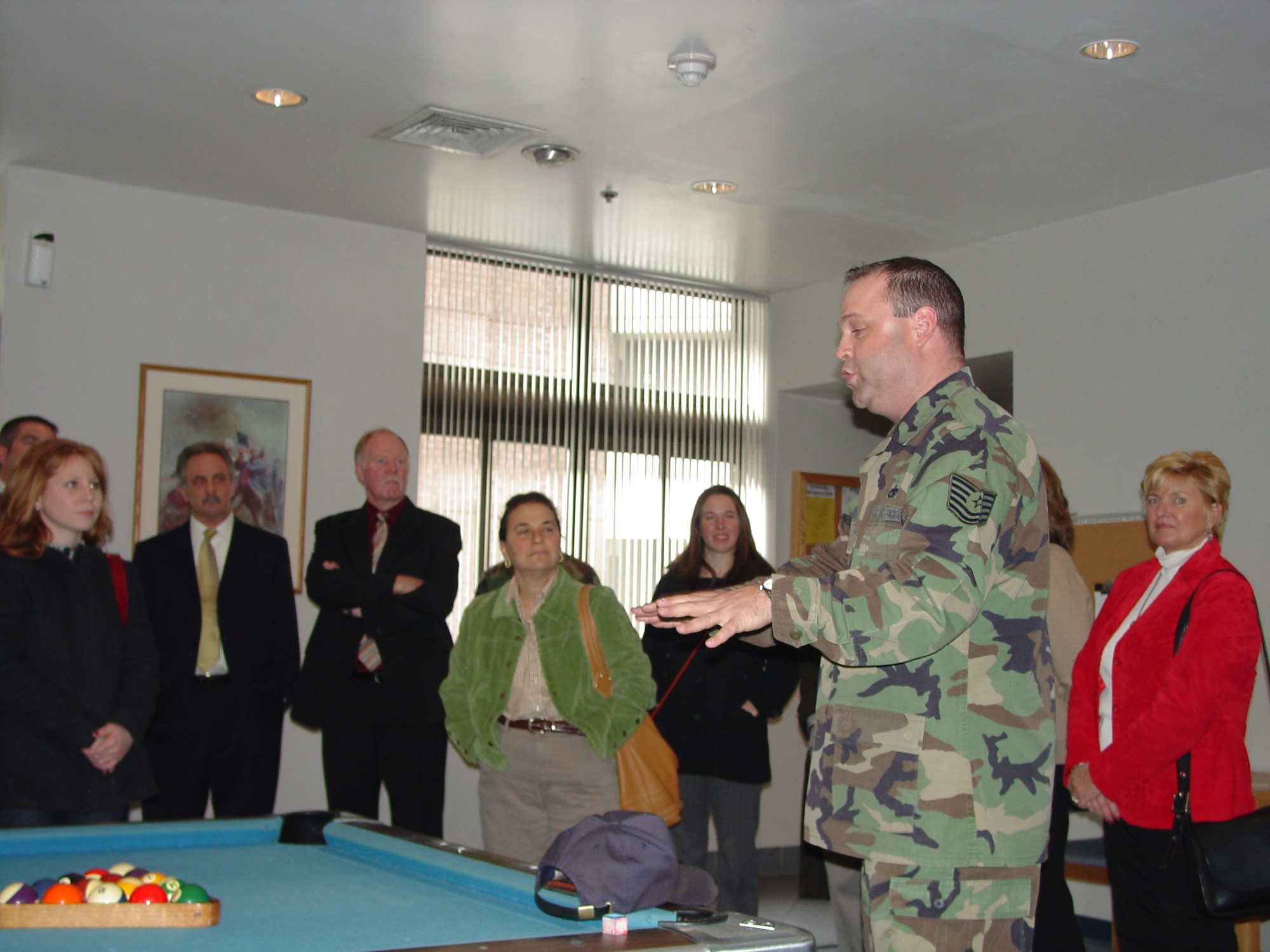 A Team McGuire member gives educators a tour of the day room in Dormitory 2424. U.S. Air Force photo by Senior Airman Dilia DeGrego