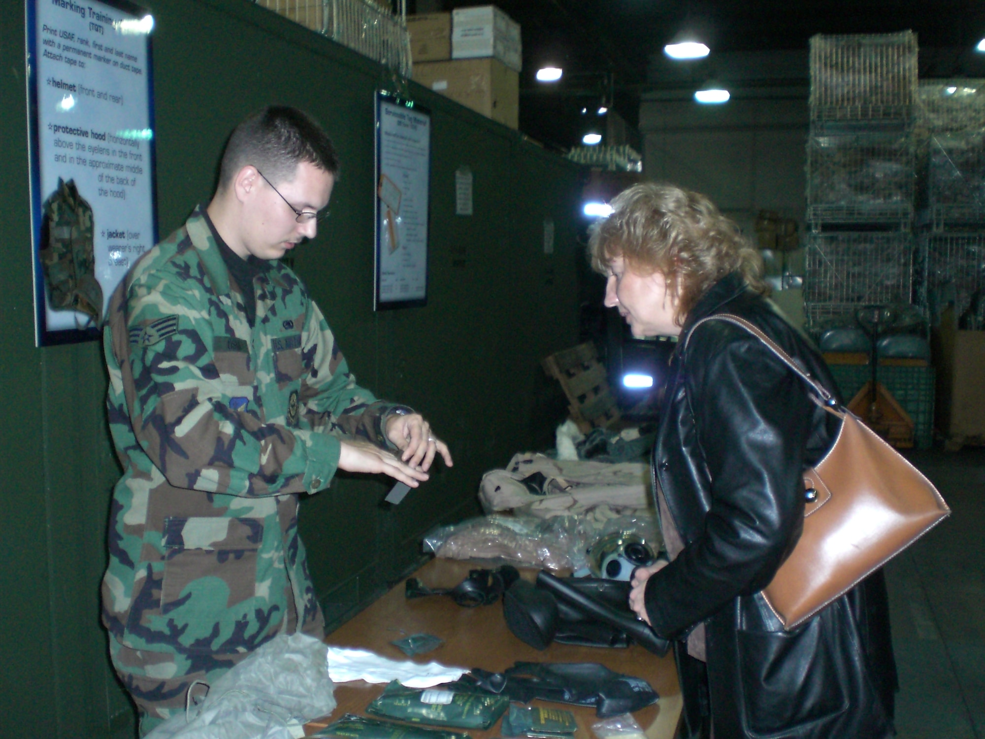 A readiness Airman from the 305th LRS speaks to tour attendees about the various equipment Airmen deploy with. U.S. Air Force photo by Senior Airman Dilia DeGrego