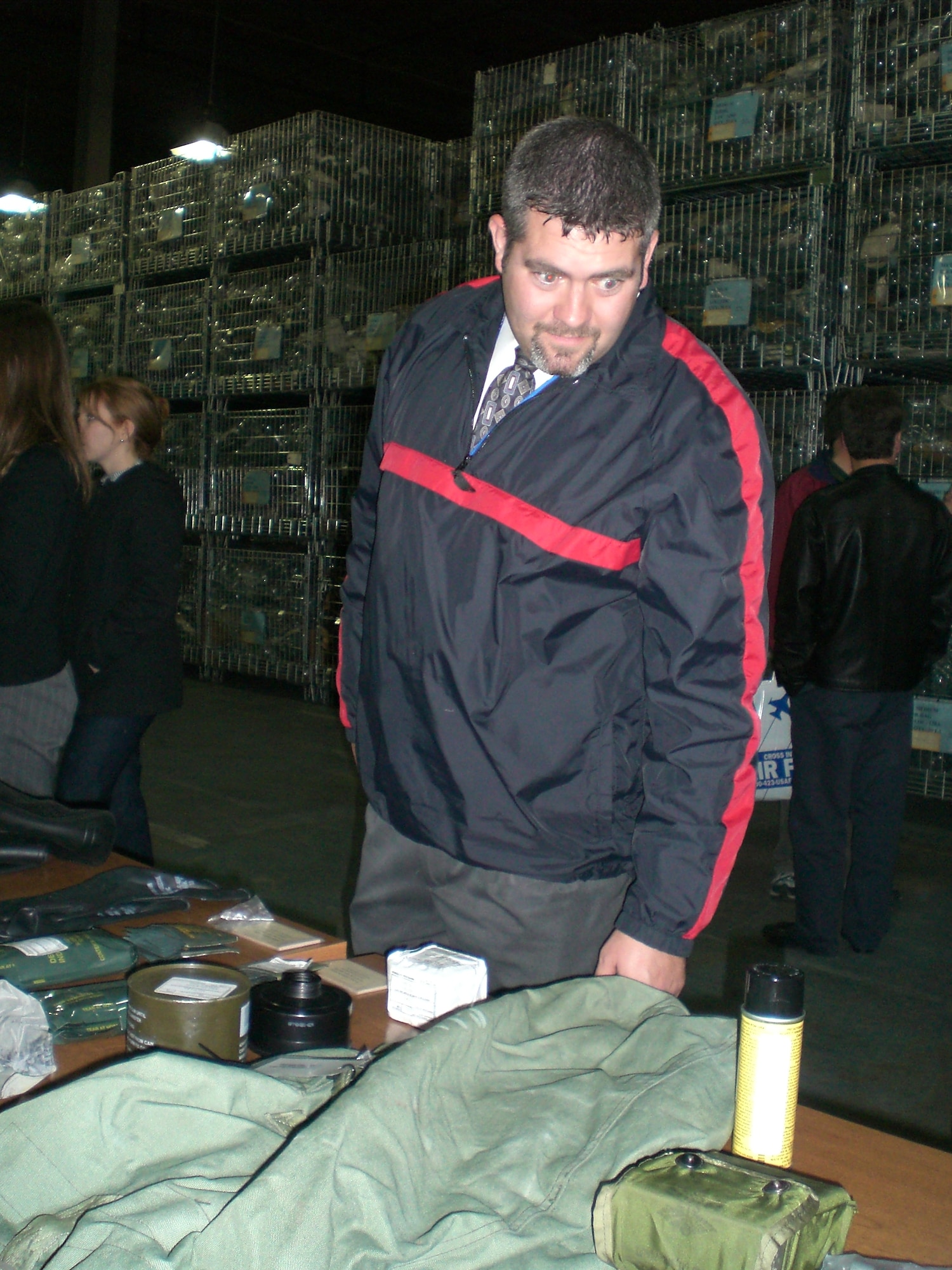 An attendee of the McGuire Educator Community Relations Tour examines various pieces of Air Force mobility equipment.  The educators visited McGuire Nov. 29 to learn about the Air Force and its mission. U.S. Air Force photo by Senior Airman Dilia DeGrego