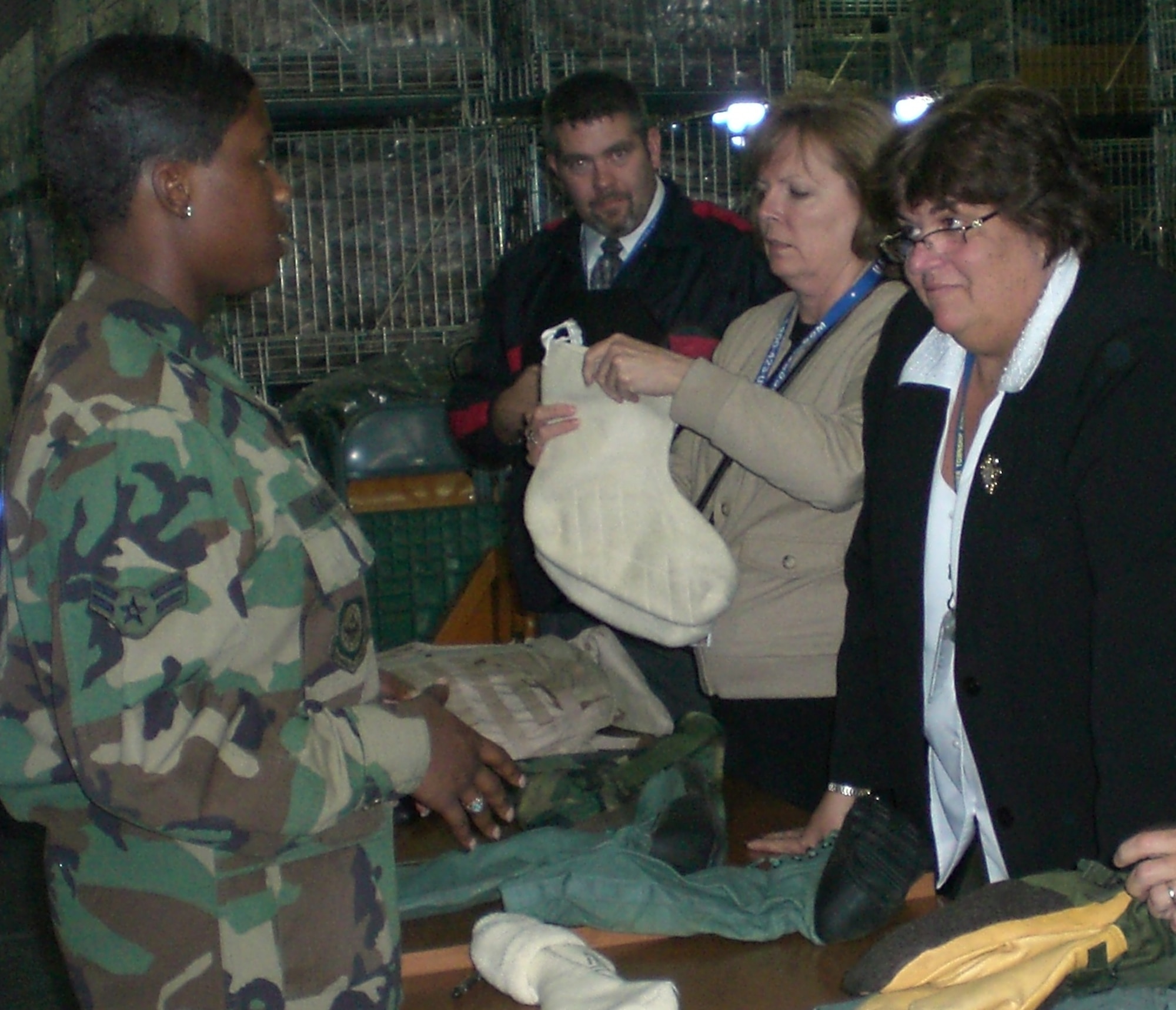 A readiness Airman from the 305th LRS speaks to tour attendees about the various equipment Airmen deploy with. U.S. Air Force photo by Senior Airman Dilia DeGrego