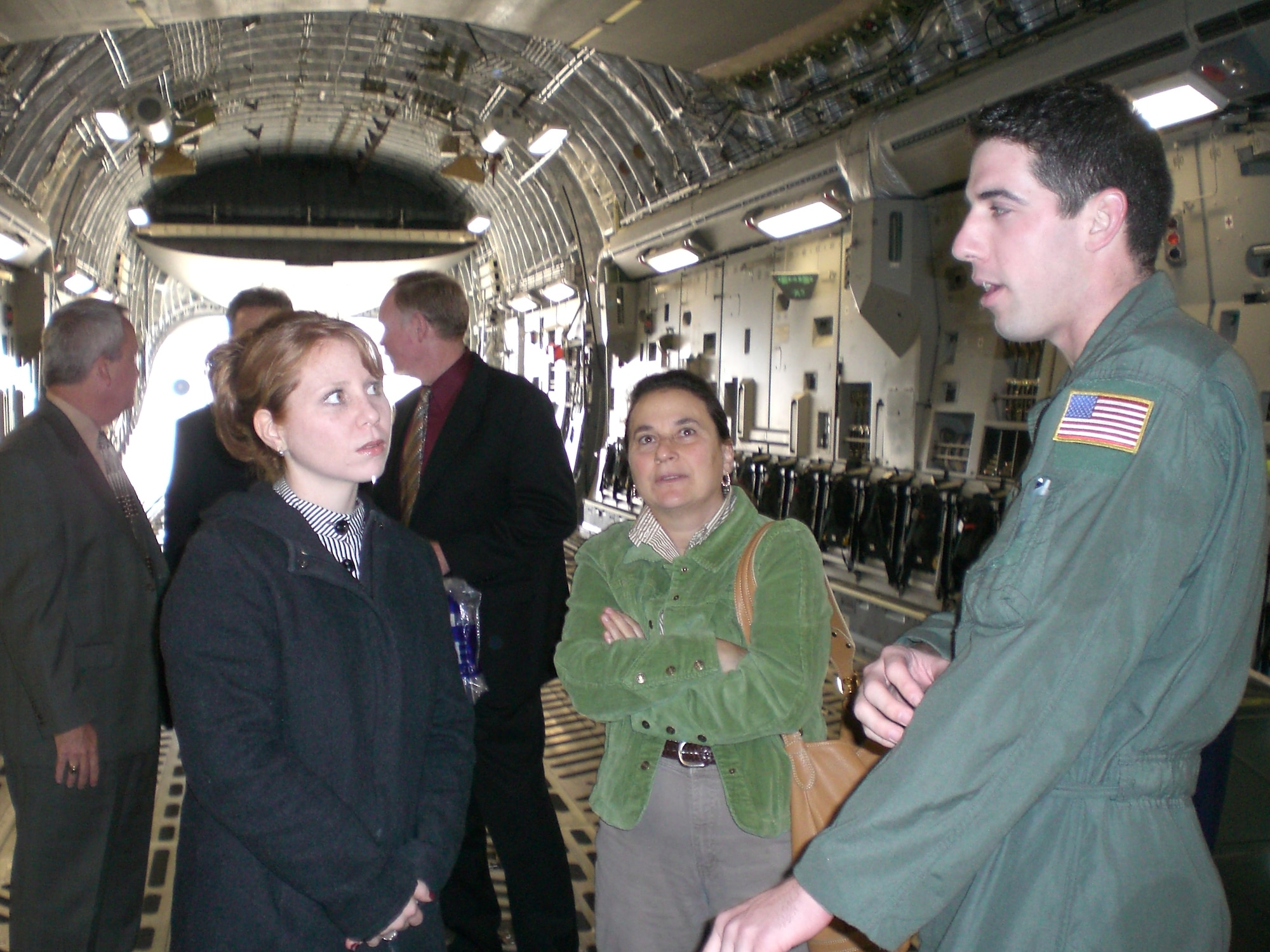 A McGuire member explains the different functions of a C-17 to a group of local educators. Educators visited McGuire Nov. 29 to learn about the Air Force and its mission. U.S. Air Force photo by Senior Airman Dilia DeGrego