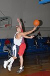 Armando Daniel for the 342nd Training Squadron at Lackland Air Force Base, Texas, balances the ball against Tom Roomsburg from Radiology, the 759th Diagnostics and Therapeutics Squadron, Jan. 26 at the Chaparral Fitness Center. (USAF photo by Robbin Cresswell)