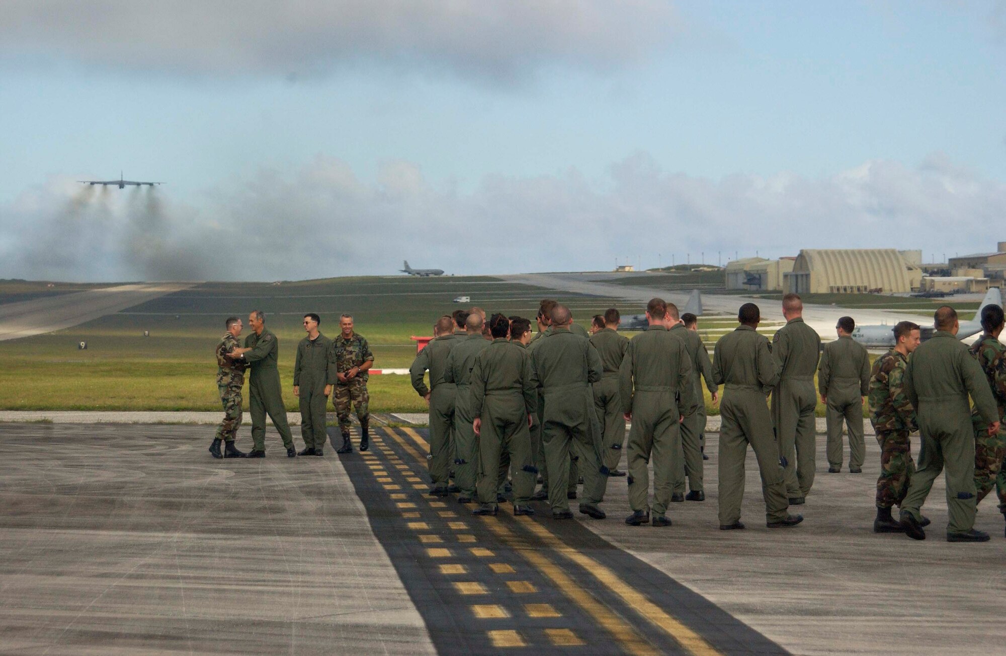 ANDERSEN AIR FORCE BASE, Guam – ‘Perfect Flight’ – Airmen deployed from Minot Air Force Base, N.D. as part of the 36th Expeditionary Operations Group celebrate the successful launch of their 200th consecutive B-52 sortie during as part of a five-month deployment to AFB, Guam.  The group’s 36th Expeditionary Aircraft Maintenance Squadron managed a 100-percent mission effectiveness rate during their deployment here. (U.S. Air Force Photo by Senior Master Sgt. Don Perrien)