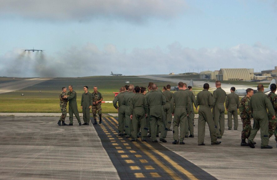 ANDERSEN AIR FORCE BASE, Guam – ‘Perfect Flight’ – Airmen deployed from Minot Air Force Base, N.D. as part of the 36th Expeditionary Operations Group celebrate the successful launch of their 200th consecutive B-52 sortie during as part of a five-month deployment to AFB, Guam.  The group’s 36th Expeditionary Aircraft Maintenance Squadron managed a 100-percent mission effectiveness rate during their deployment here. (U.S. Air Force Photo by Senior Master Sgt. Don Perrien)