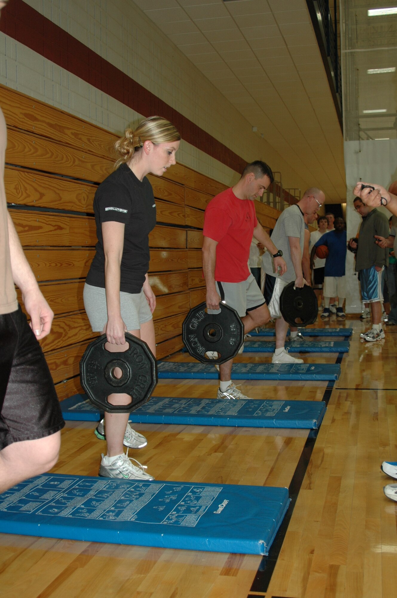 Competitors in the Iron Flight Competition are tested with various events including a five-minute sit-up event, suicide sprints, a weight balance and a weighted run. The 28th Mission Support Squadron team, composed of Lt. Col. Dean Hullings, Senior Master Sgt. Chadwick Eiring, Tech. Sgt. James Delo, Staff Sgt. Andrea Cogar and Staff Sgt. Eric Utrecht, beat the other five teams. (U.S. Air Force photo/Airman Nathan Riley)