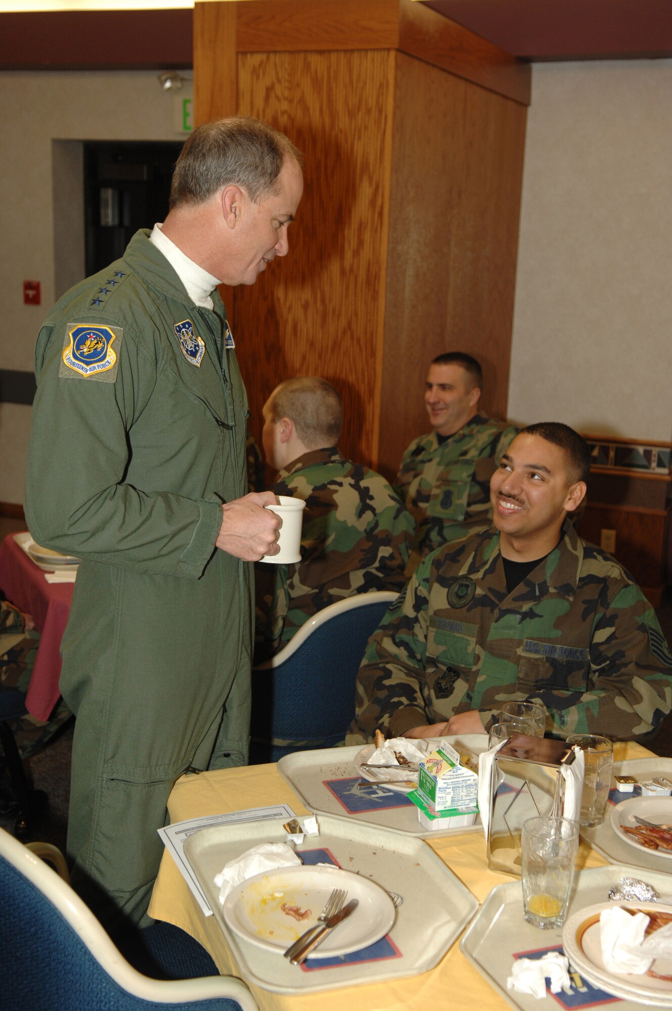 MINOT AIR FORCE BASE, N.D. – Gen. Kevin P. Chilton, Air Force Space Command commander, speaks to Tech. Sgt. Detrick Thomas, 91st Maintenance Group, during breakfast at the Dakota Inn Dining Facility here Jan. 23. General Chilton visited Minot’s 91st Space Wing as part of a base orientation to familiarize him with the wings now under his command. (U.S. Air Force photo by Airman 1st Class Christopher Boitz)