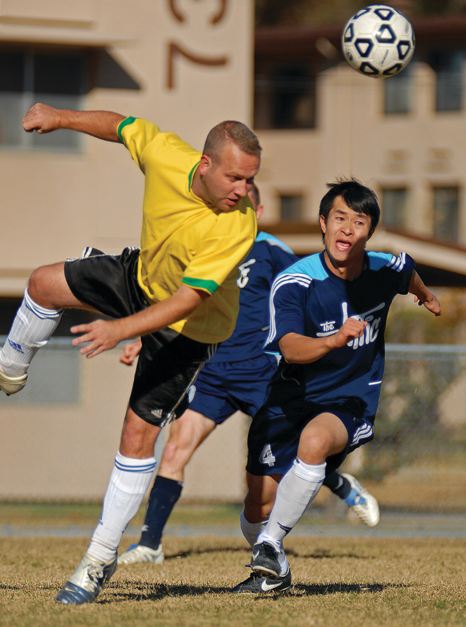 OSAN AIR BASE, Republic of Korea --  Ian Snowsill, 51st Maintenance Group, headbutts the ball as the Osan Mustangs try to move the ball down field to the Cheongju Tigers’ goal. The Mustangs, Osan's soccer club, plays in the amateur 'Super Sunday Futbol League.  (Photo by Staff Sgt. Joshua Klahn)